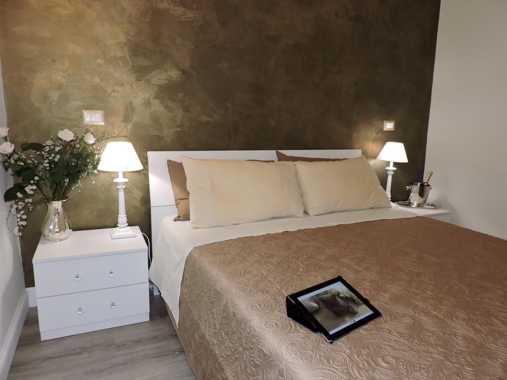 Anfiteatro Suite Rome Bagian luar foto
